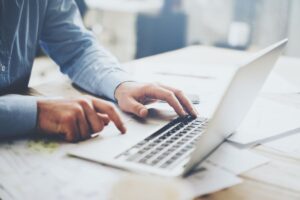 Start A Side Hustle In Lockdown - Man working at a computer